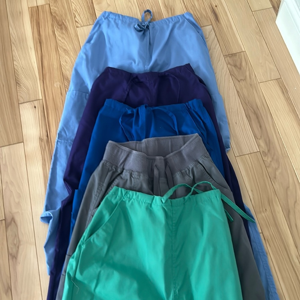 5 pair of scrub pants. All size XS. Excellent  condition. Different brands.